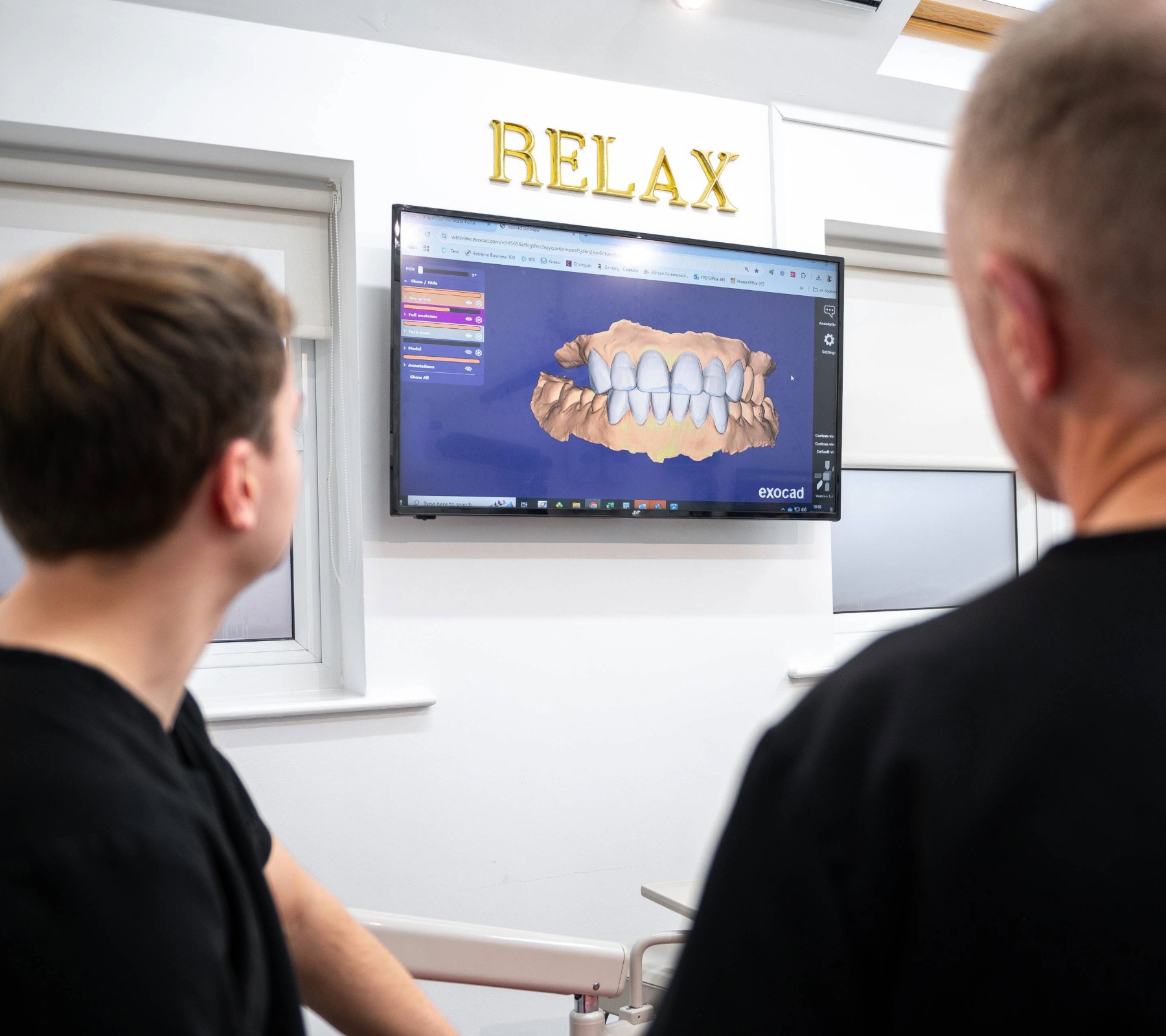 Dentists assessing a 3D digital scan for dental implants in Carlisle