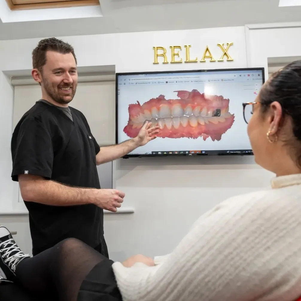 Dentist explaining a patient's digital smile scan during a personalised consultation at York Place Dental in Carlisle.