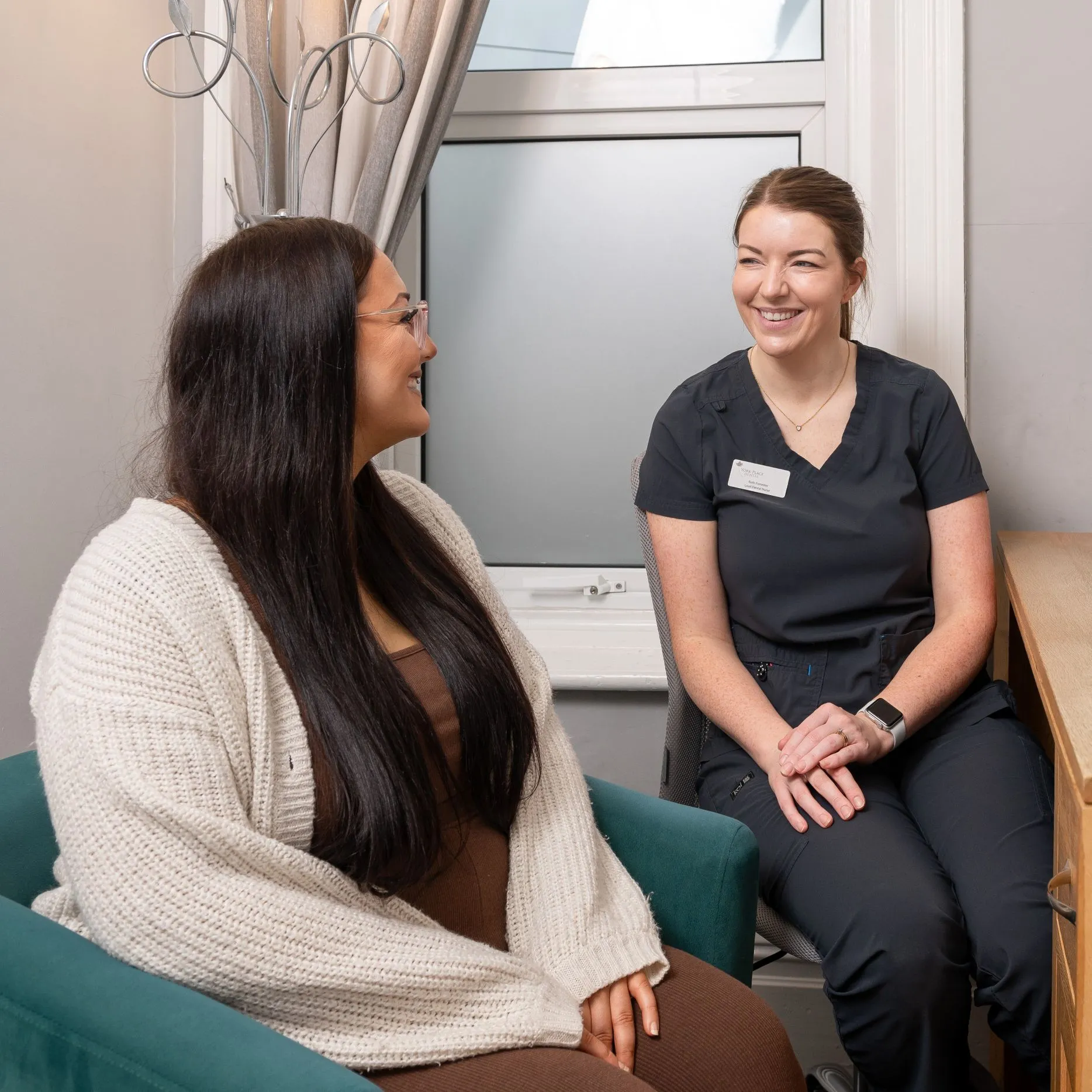 York Place Dental team member talking with a patient during a consultation